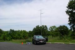A view of the VHF station and solar panels against a partly cloudy sky - Photo by Fred Soop