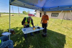 McHenry County Century Bike Run net control surveys map as Wendell (N9REP) looks on