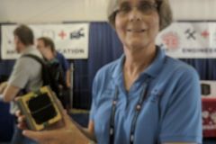 JoAnne K9KJM showing off a model of the Fox-1 cubesat at Xenia.