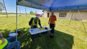 McHenry County Century Bike Run net control surveys map as Wendell (N9REP) looks on