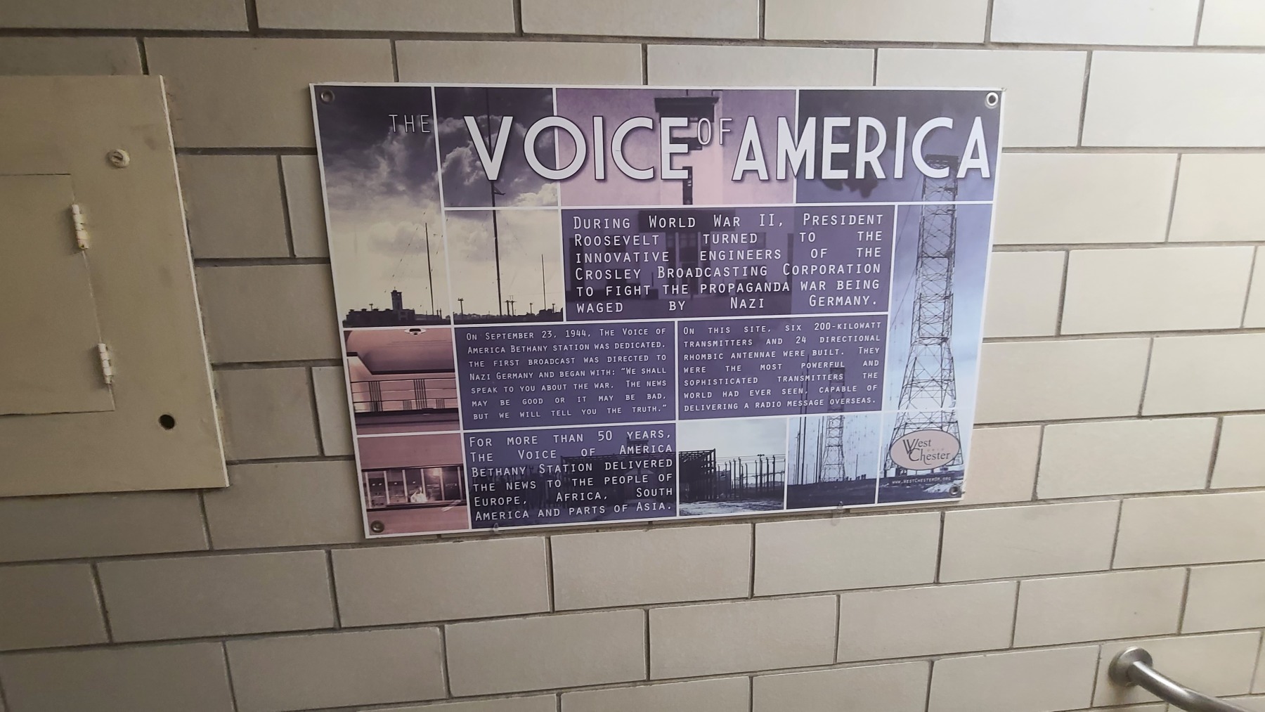 VOA poster at building entrance