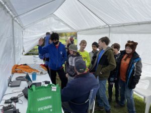 Dave (K9AT) poses a question to the scouts