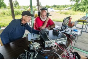 Roger KF9D and Joel W9NXM discuss strategy - Photo by Ken Farver
