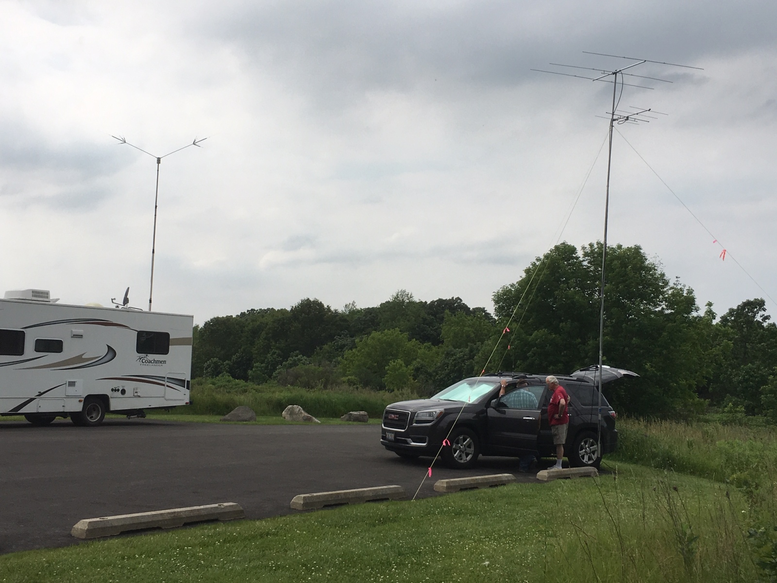 Mike WB8BZK and an unidentified person having a discussion at the VHF station