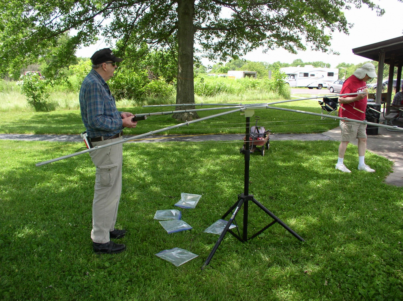 Pierre K9EYE checking the cobweb antenna as Mike WB8BZK passes by - Photo by Fred Soop