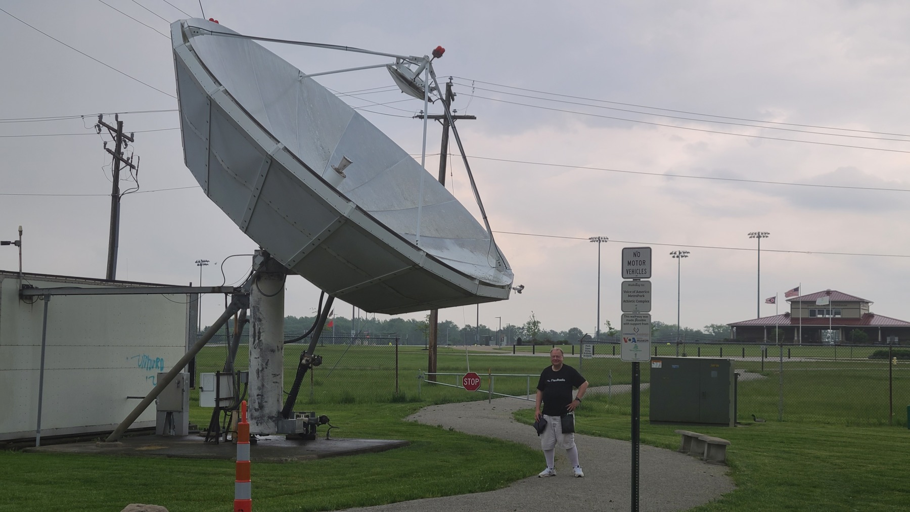 Ralph (WB9ICF) stands next to the WC8VOA 10 GHz EME antenna
