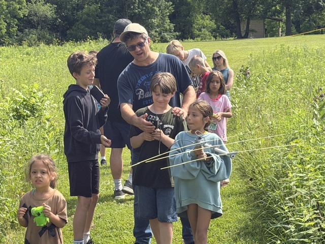A group of children searching for the hidden transmitter
